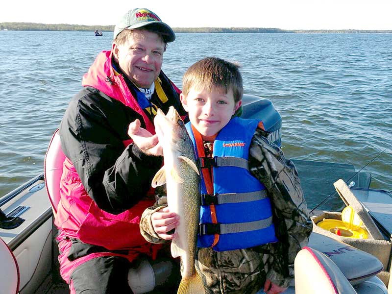 Remington Fishing Guide Randy Erola with young walleye fisherman
