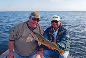 Remington Guide Service, Randy Erola with client and walleye